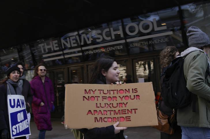 People attend a protest in front of the Parsons School of Design in Greenwich Village on Nov. 17, 2022.